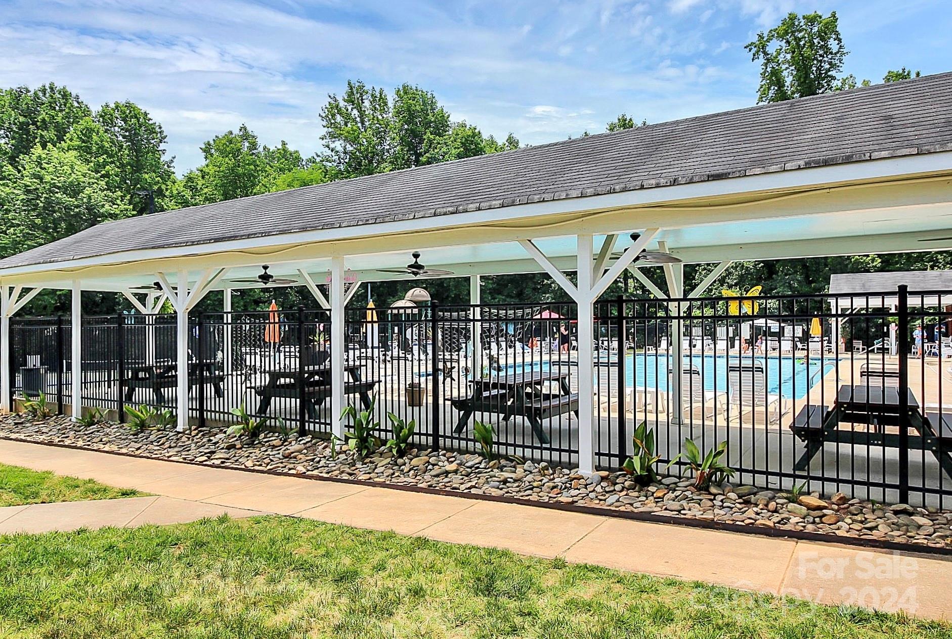 536 St George Road Fort Mill, SC 29708 - Photo 47 of 48 a view of a patio with table and chairs under an umbrella