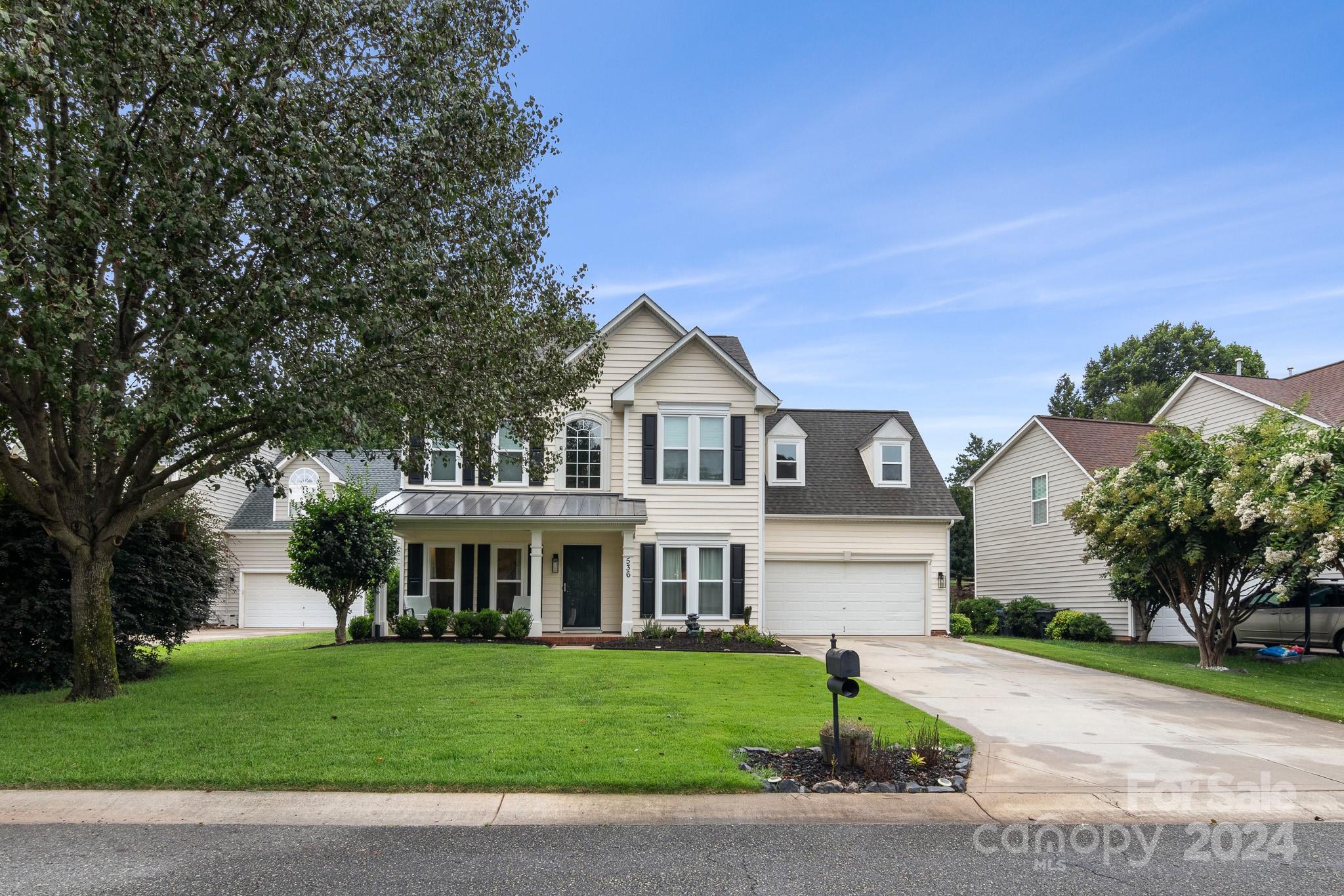536 St George Road Fort Mill, SC 29708 - Photo 5 of 48 a front view of a house with a garden and plants