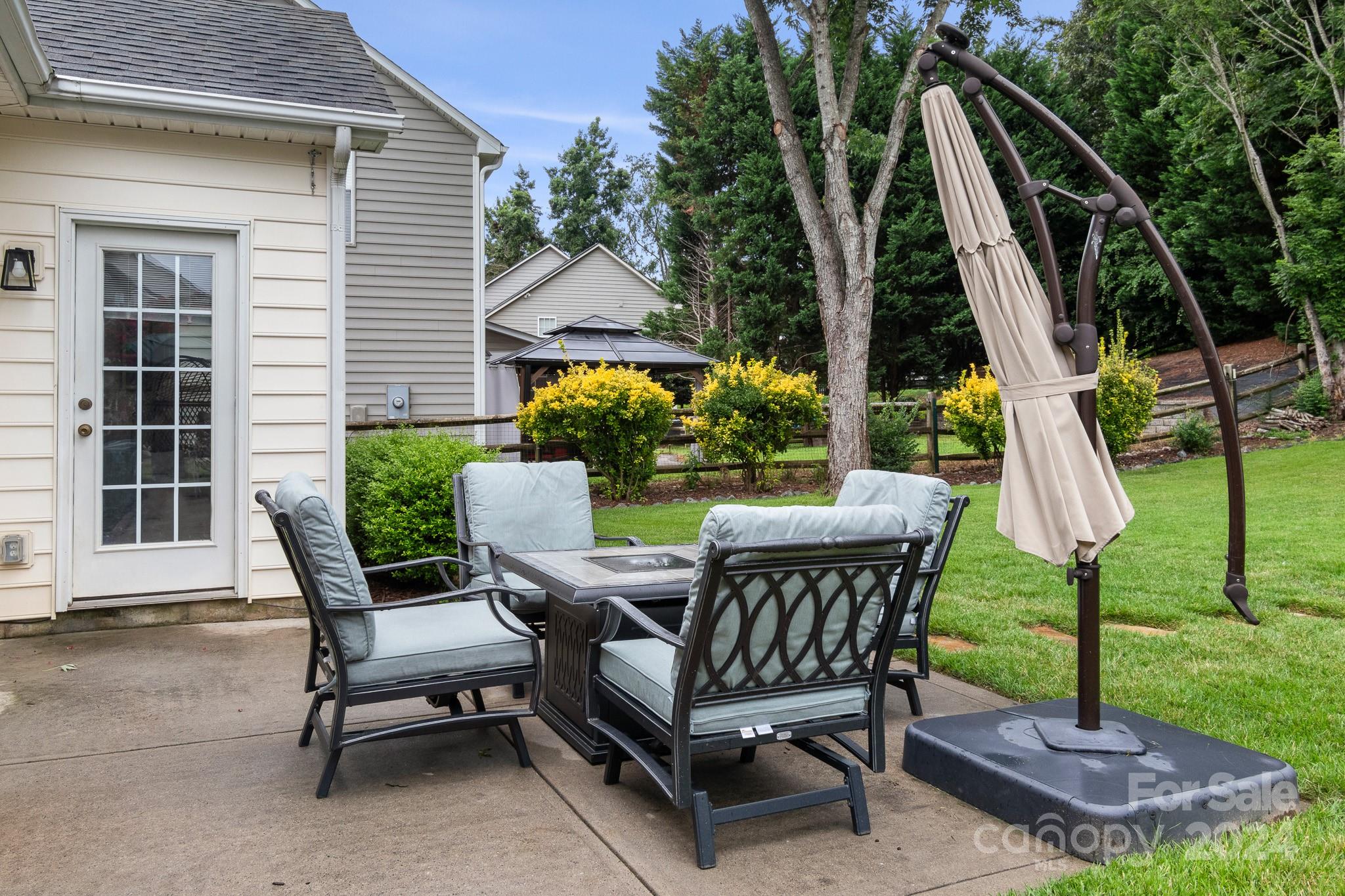 536 St George Road Fort Mill, SC 29708 - Photo 8 of 48 a view of a patio with a table chairs and a yard