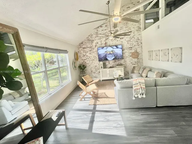 a view of a hallway view with wooden floor and staircase