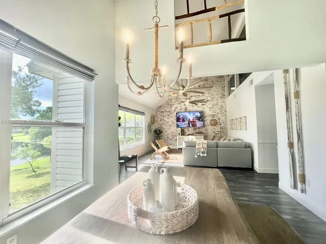 a view of a dining area with furniture window and wooden floor