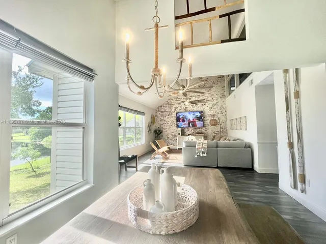 a view of a dining area with furniture window and wooden floor