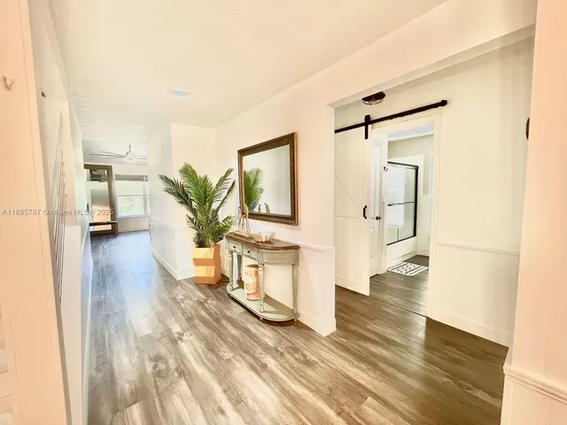 a view of living room with furniture and flat screen tv
