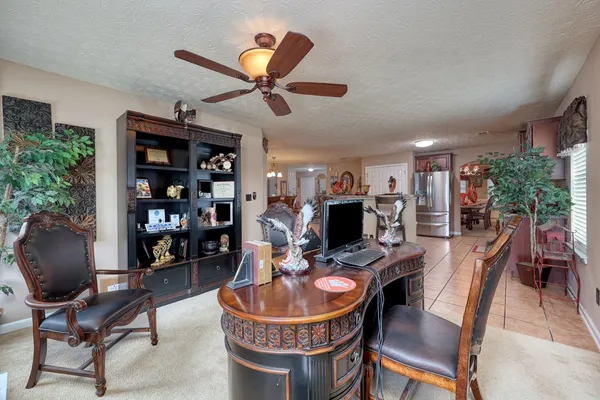 a work room with furniture and wooden floor