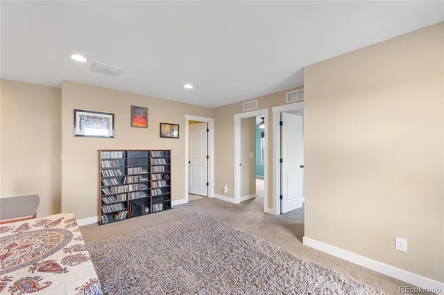 a view of a bedroom with closet and cabinet