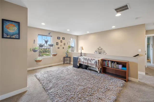 a living room with furniture and a rug