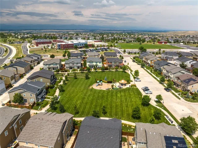 an aerial view of residential houses with outdoor space
