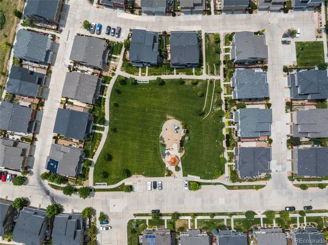 an aerial view of houses with outdoor space