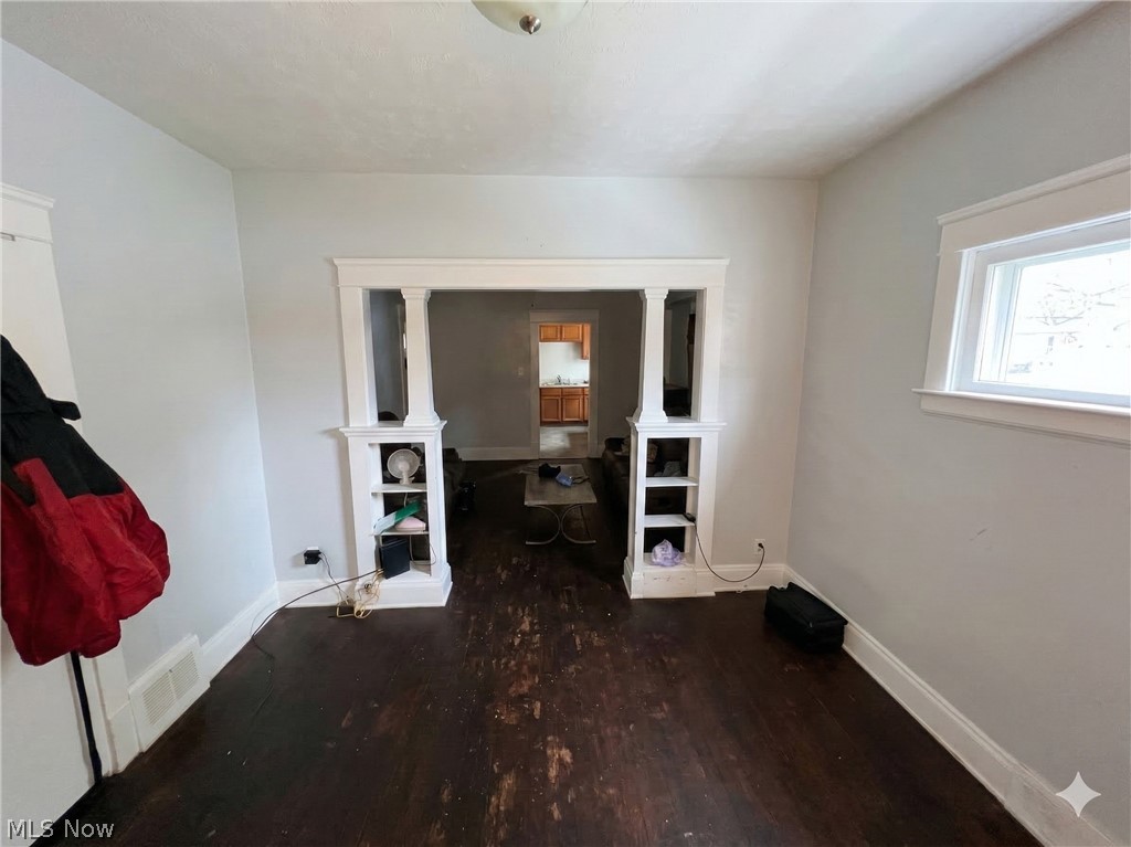 10112 Aetna Road Cleveland, OH 44105 - Photo 9 of 31 Bedroom with dark wood-style floors and baseboards