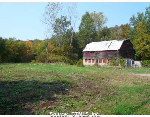 0 Newton Road Northfield, CT 06778 - Photo 1 of 1 a view of a house with a yard and a forest