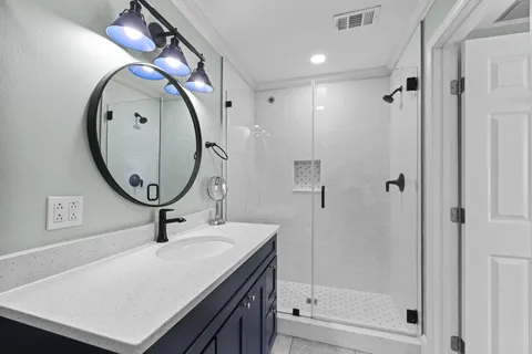 a bathroom with a mirror and a sink