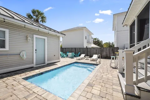 a view of a patio with couches chairs and a fire pit