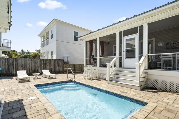 front view of a house with a outdoor sitting area