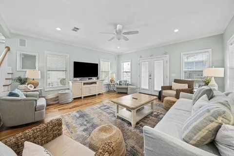 a living room with furniture and a flat screen tv