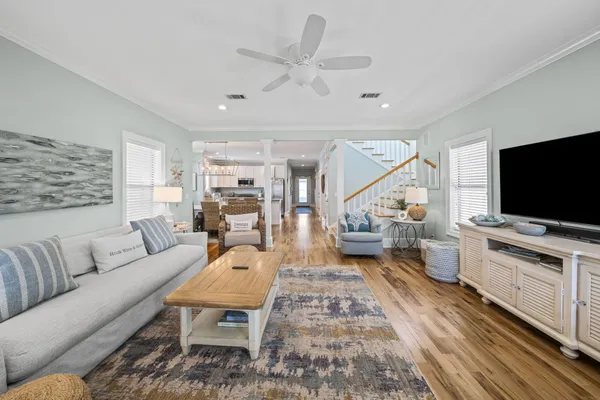 a living room with furniture and a flat screen tv