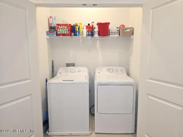 a utility room with dryer and washer