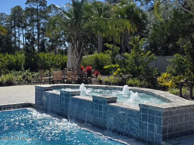 a view of a backyard and kitchen