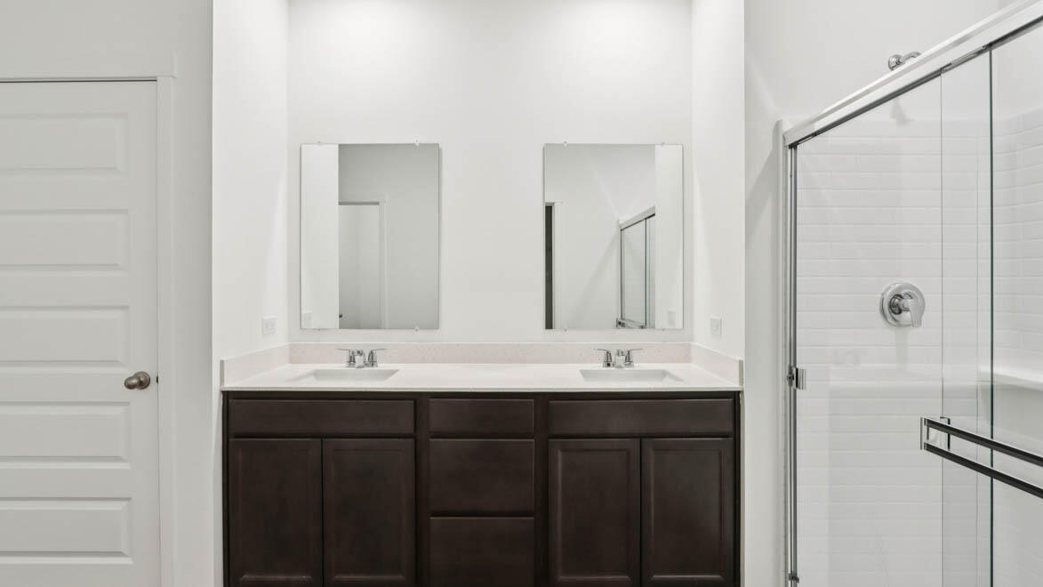 7641 West 106th Place Crown Point, IN 46307 - Photo 27 of 31 a bathroom with double sink and a mirror