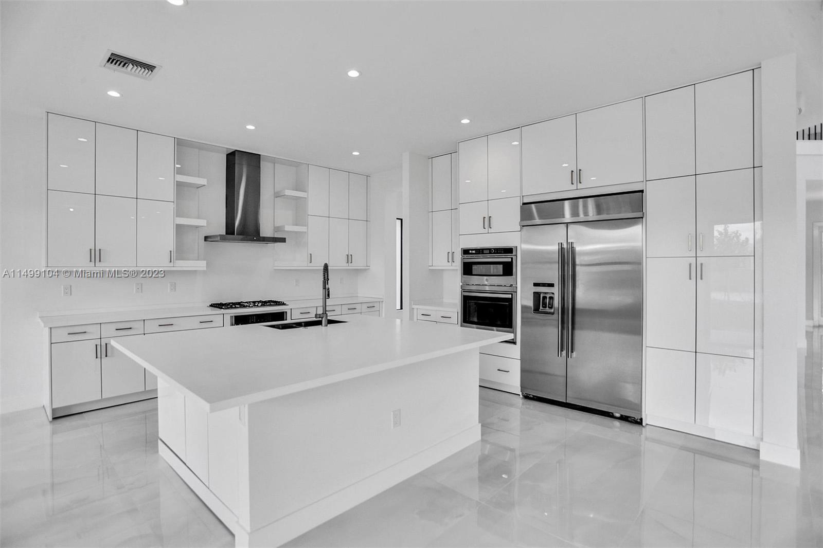 17185 Teton River Road Boca Raton, FL 33496 - Photo 21 of 89 a kitchen with stainless steel appliances a refrigerator sink and white cabinets