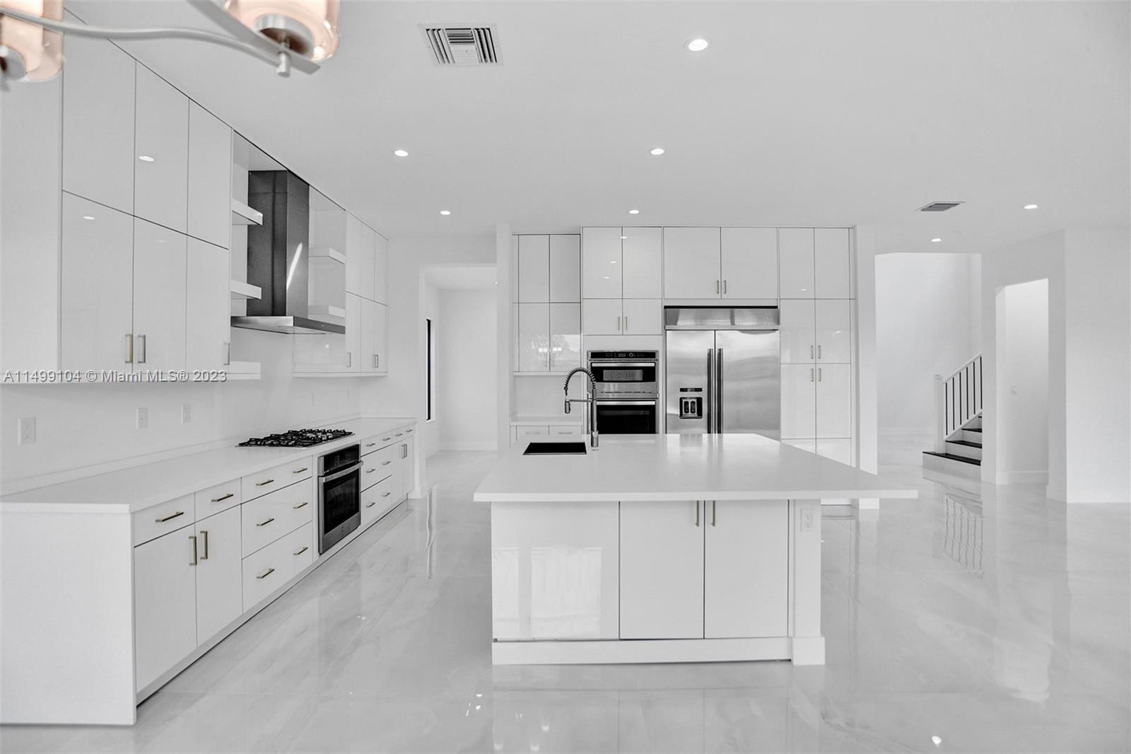 17185 Teton River Road Boca Raton, FL 33496 - Photo 25 of 89 a kitchen with cabinets and stainless steel appliances