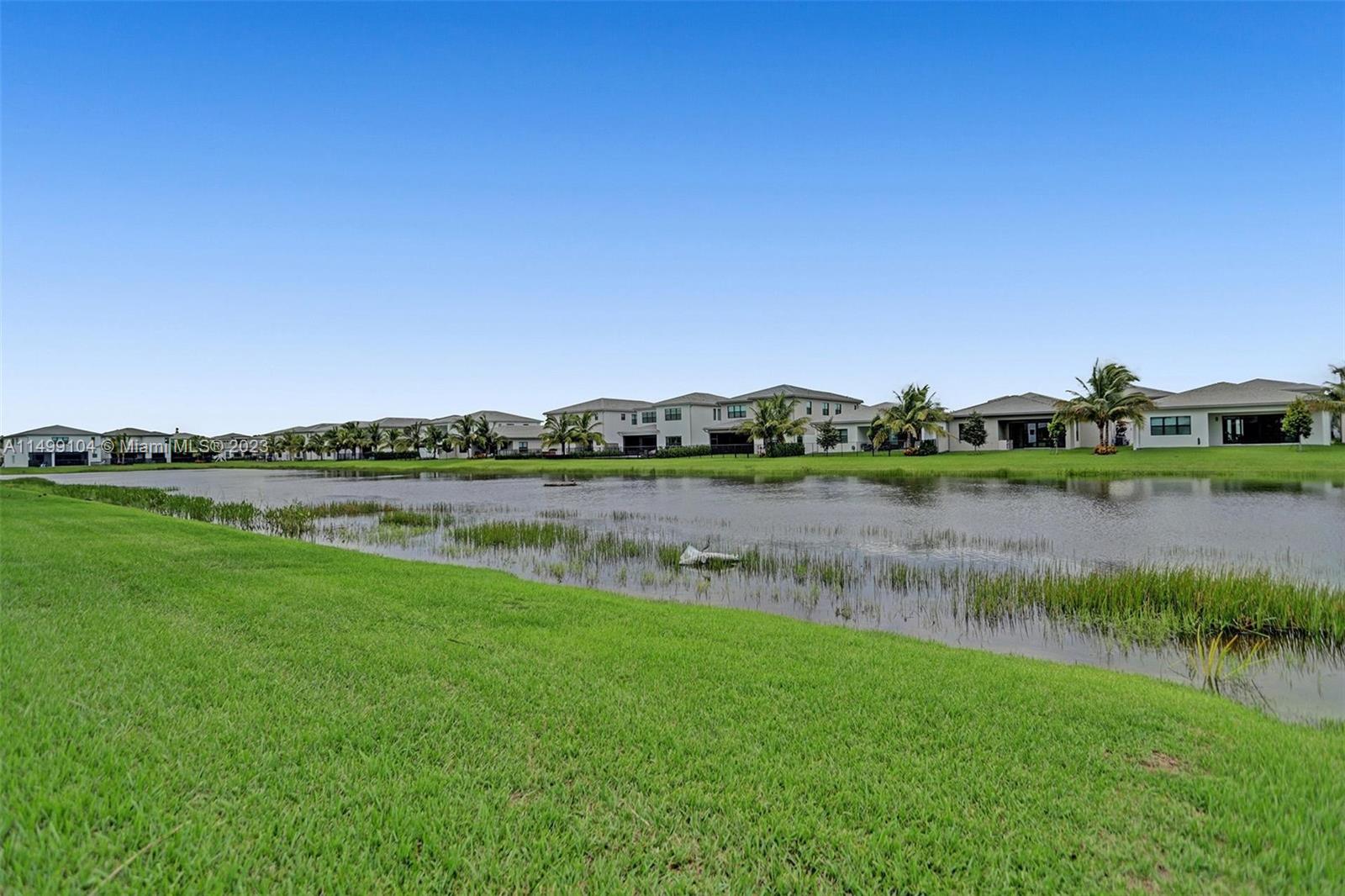 17185 Teton River Road Boca Raton, FL 33496 - Photo 31 of 89 a view of a lake with houses in the back