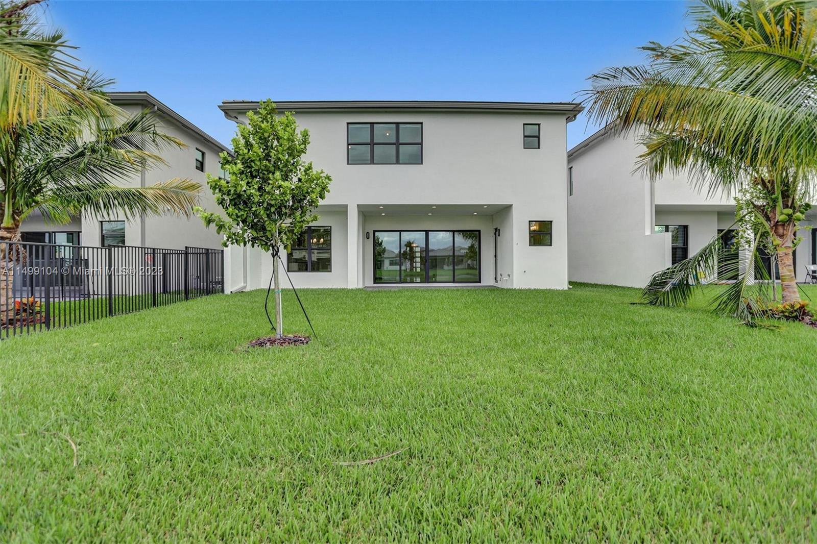 17185 Teton River Road Boca Raton, FL 33496 - Photo 33 of 89 a view of a house with a yard and palm tree