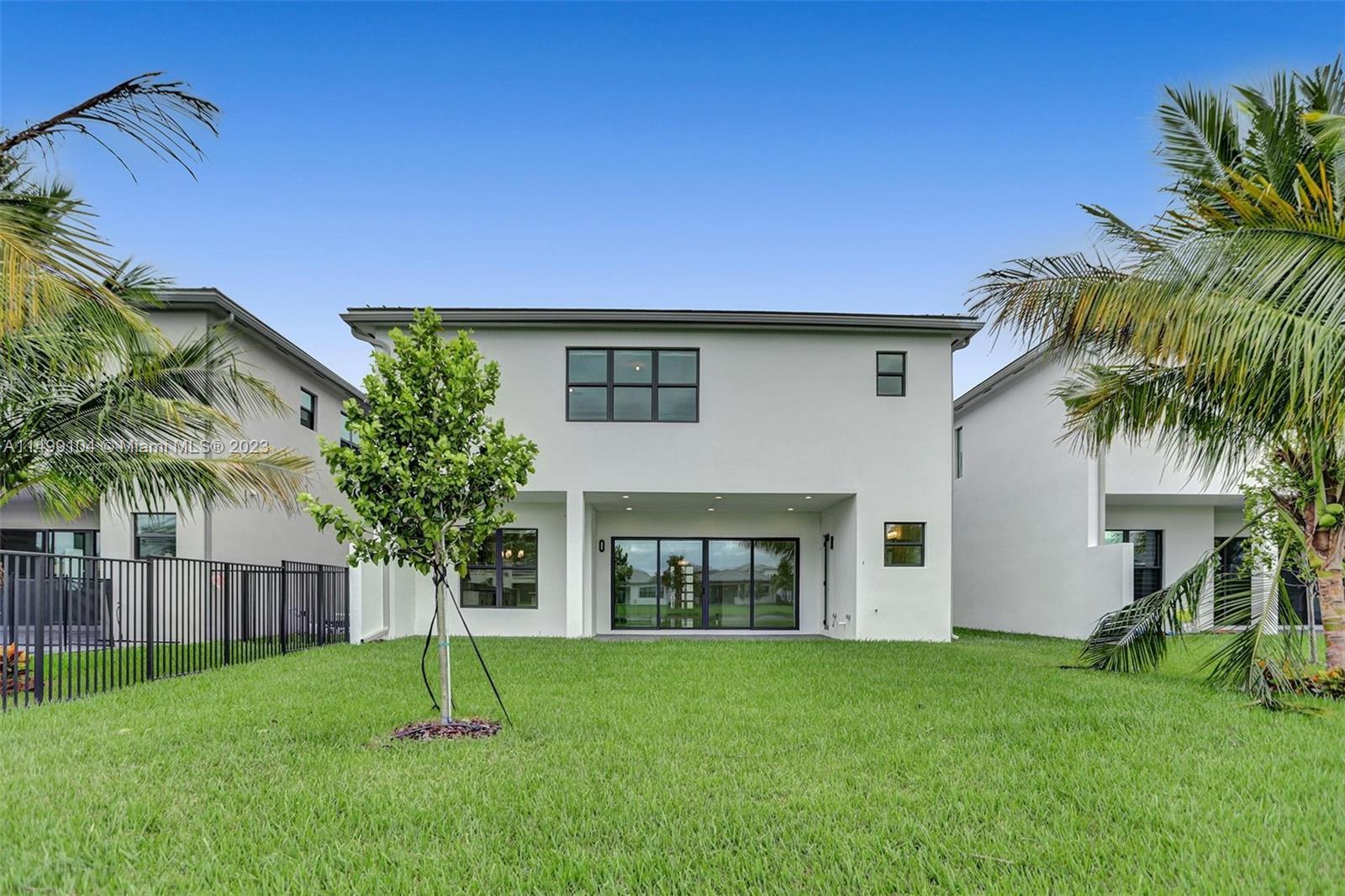 17185 Teton River Road Boca Raton, FL 33496 - Photo 34 of 89 a house that has a garden in front of it