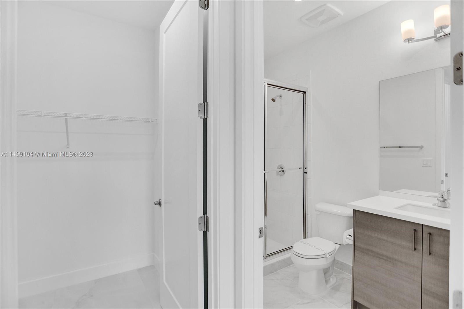 17185 Teton River Road Boca Raton, FL 33496 - Photo 51 of 89 a bathroom with a sink a toilet and shower