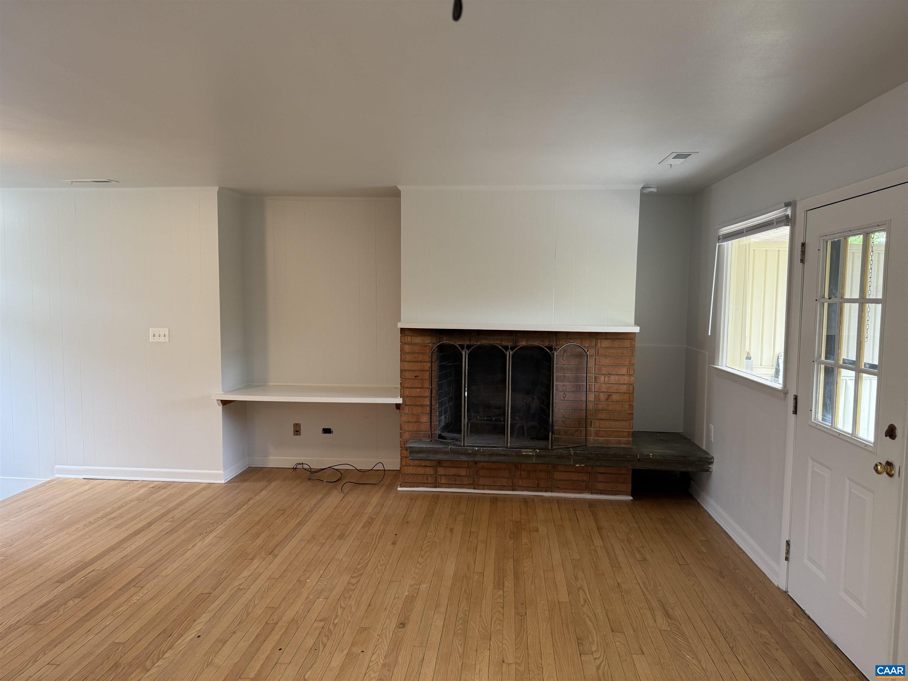 115 Apple Tree Road Charlottesville, VA 22903 - Photo 3 of 11 a view of empty room with wooden floor and fan