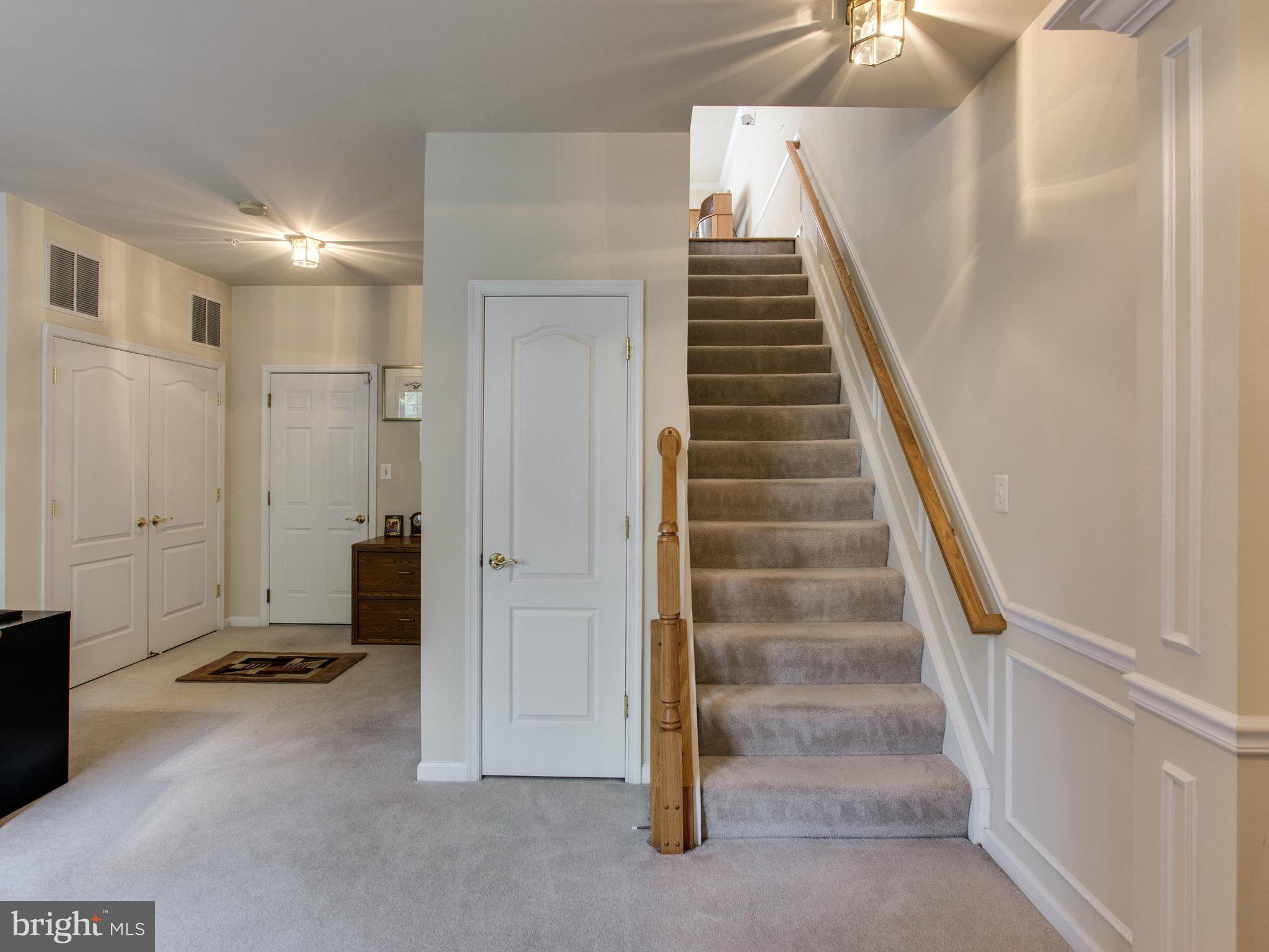 9823 Darcy Forest Drive Silver Spring, MD 20910 - Photo 2 of 30 a view of an entryway with stairs