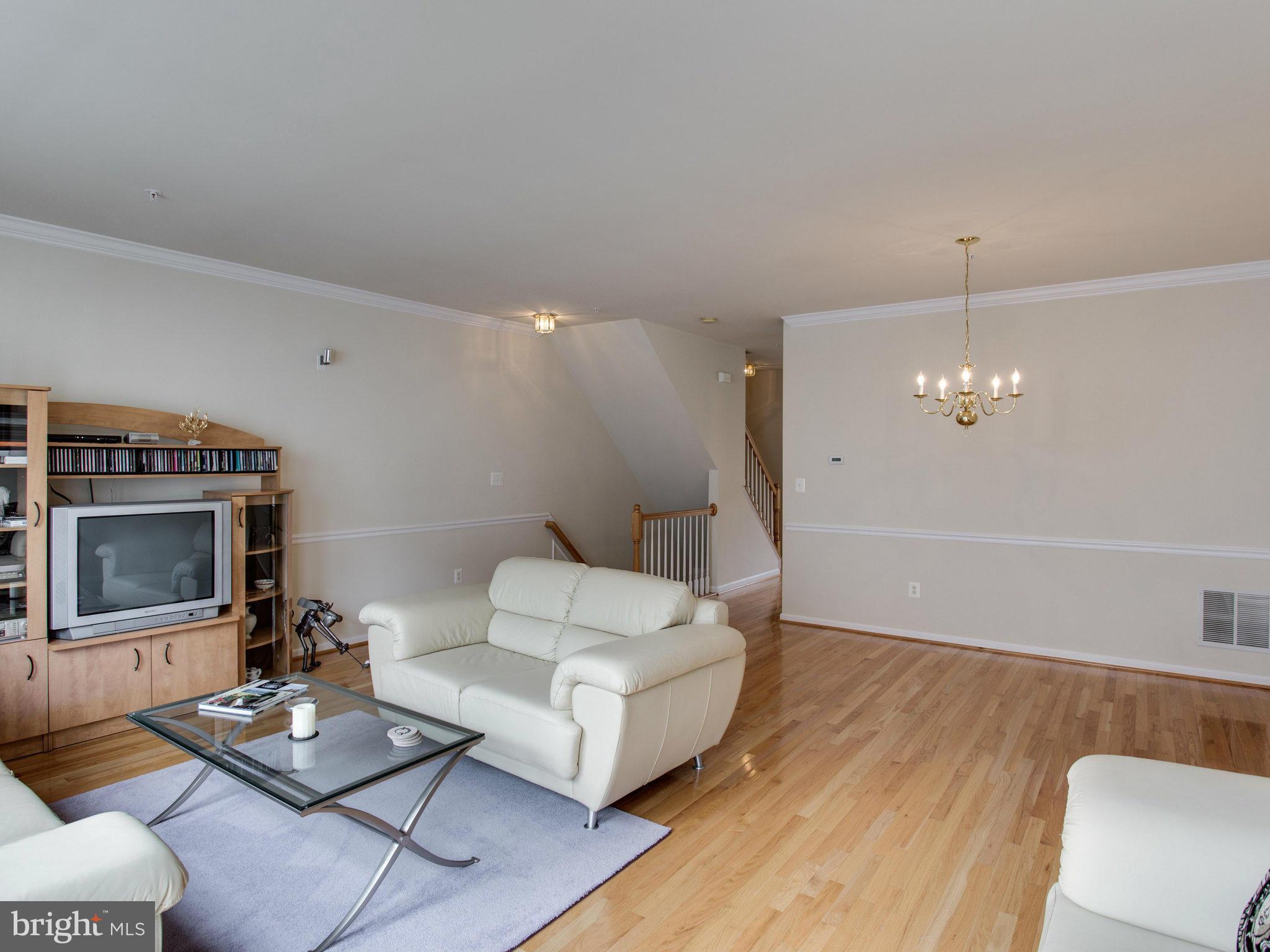 9823 Darcy Forest Drive Silver Spring, MD 20910 - Photo 13 of 30 a living room with furniture and a fireplace