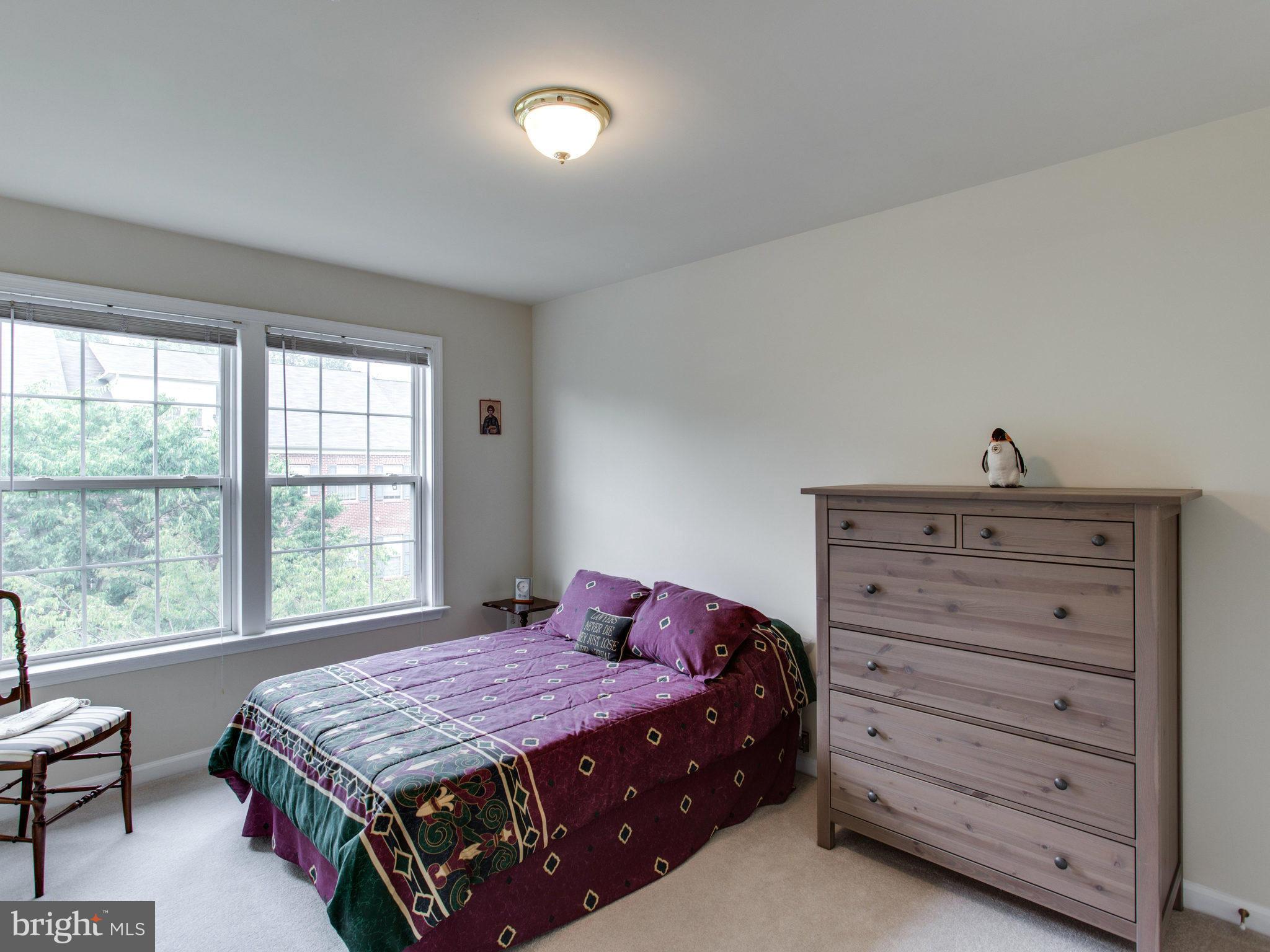 9823 Darcy Forest Drive Silver Spring, MD 20910 - Photo 27 of 30 a bedroom with a bed and a dresser