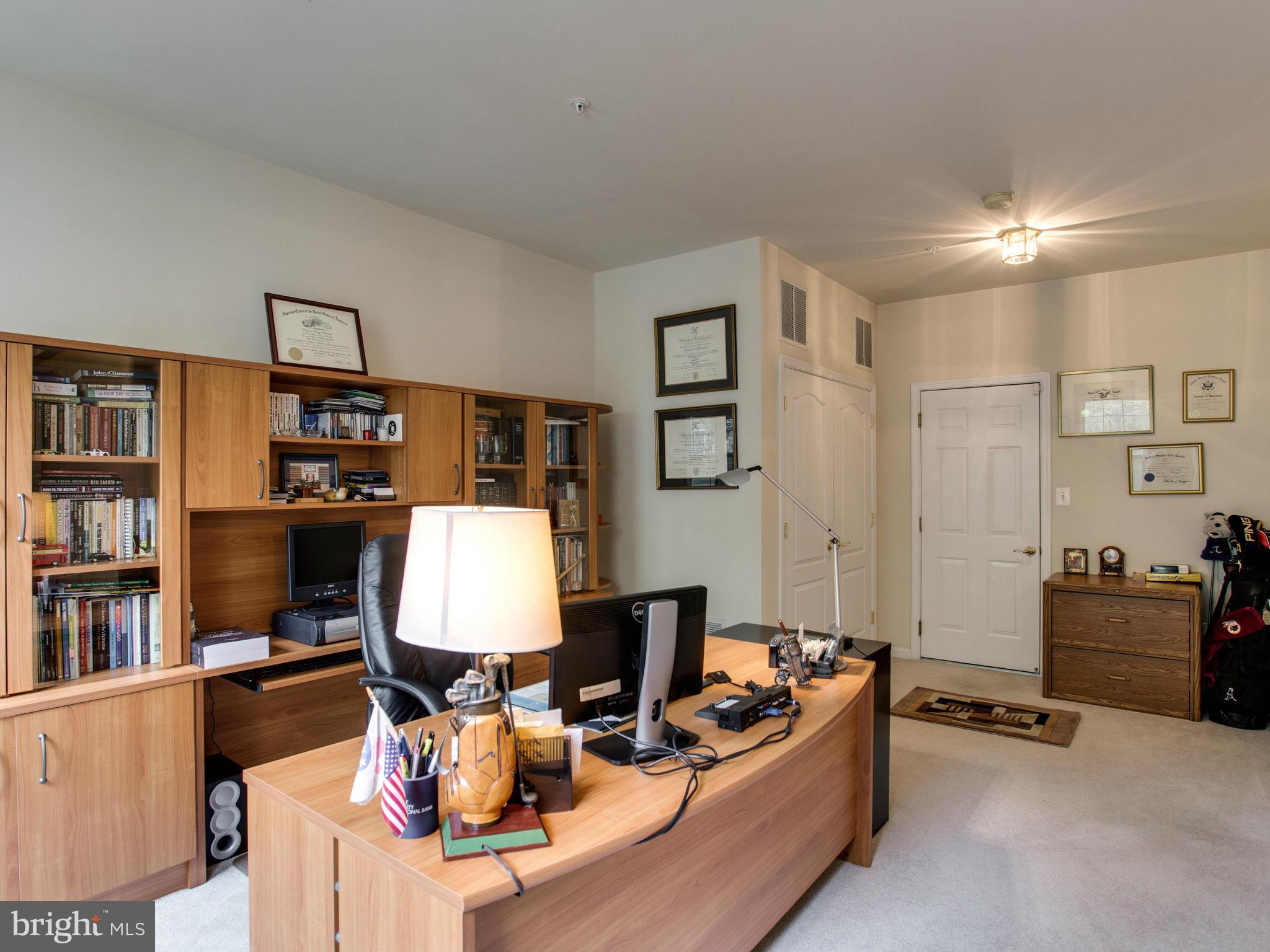 9823 Darcy Forest Drive Silver Spring, MD 20910 - Photo 4 of 30 a living room with furniture a rug and a lamp