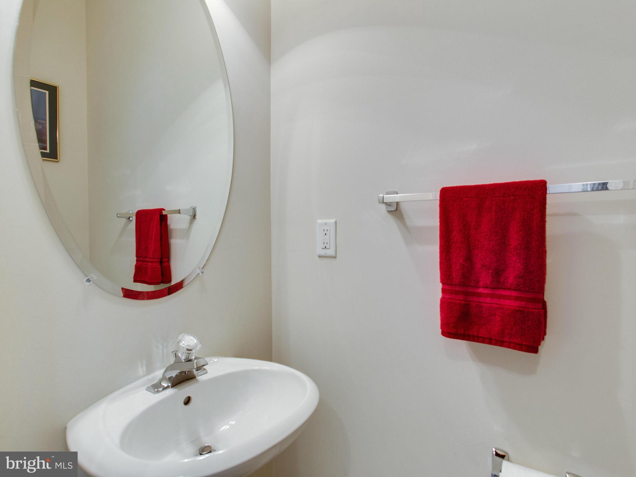 9823 Darcy Forest Drive Silver Spring, MD 20910 - Photo 8 of 30 a bathroom with a sink and a mirror