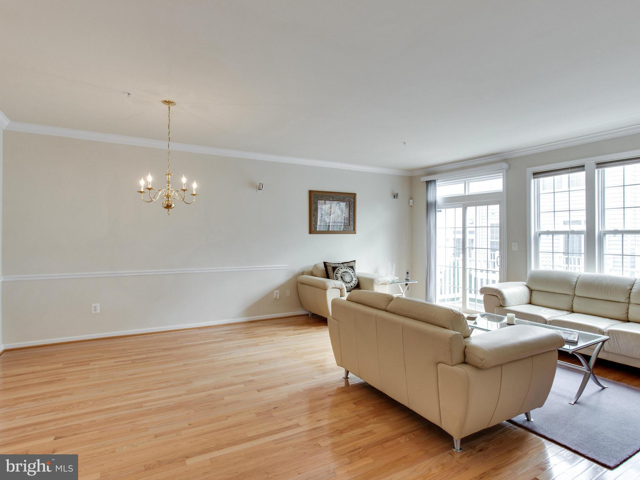 9823 Darcy Forest Drive Silver Spring, MD 20910 - Photo 9 of 30 a living room with furniture and wooden floor
