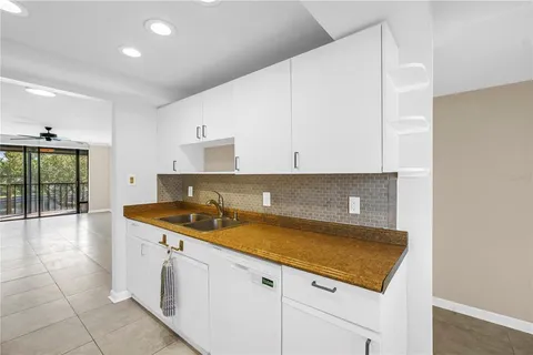 a kitchen with a sink and cabinets