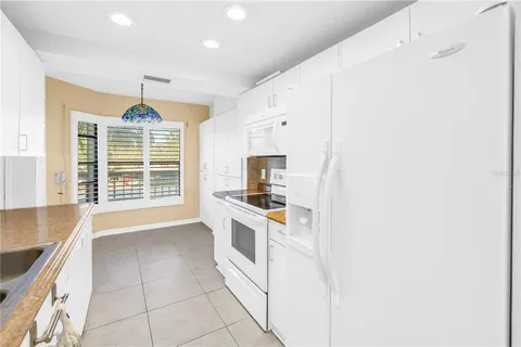 a view of a big room with wooden floor and windows in a room