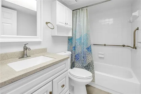 a view of a balcony with wooden floor