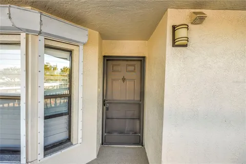 a view of swimming pool with seating space