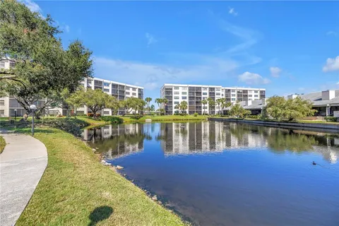 a living room with furniture and a book shelf