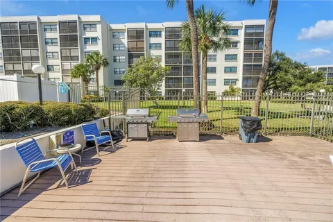 a view of a door and wooden floor