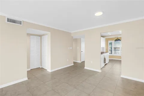 a view of a livingroom with a ceiling fan and window