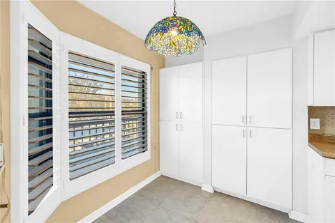 a kitchen with stainless steel appliances granite countertop a sink and cabinets