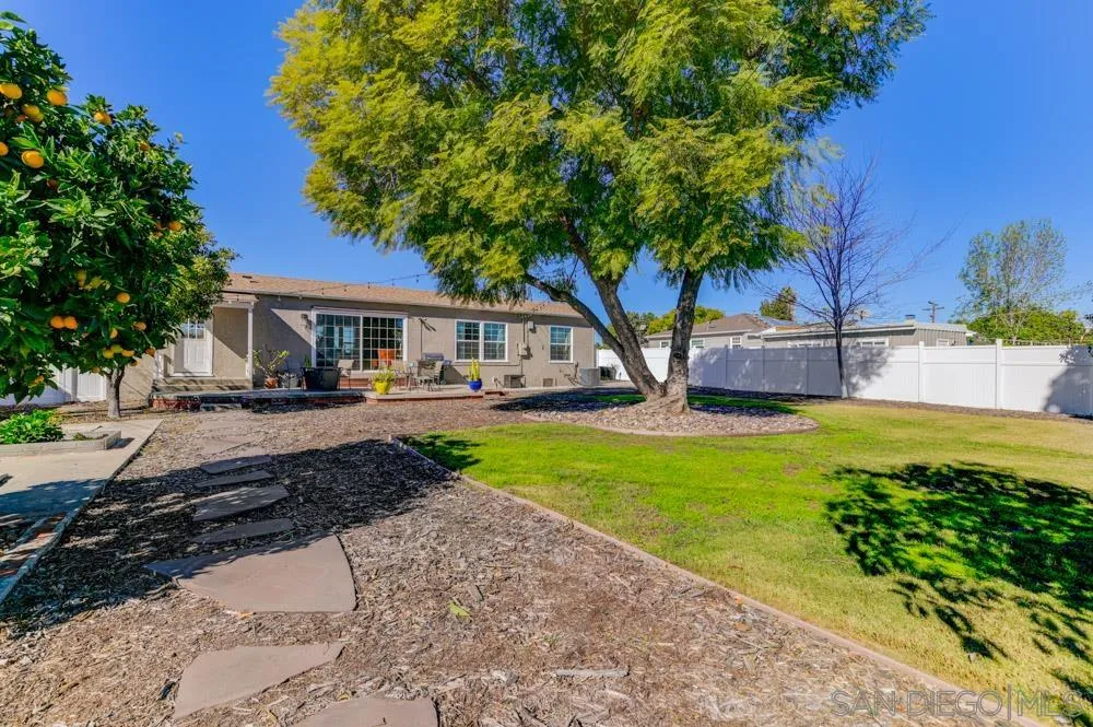 6244 Lorca Drive San Diego, CA 92115 - Photo 13 of 25 a view of a house with garden and a sitting area