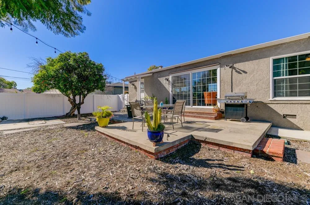 6244 Lorca Drive San Diego, CA 92115 - Photo 16 of 25 a view of a house with backyard and sitting area