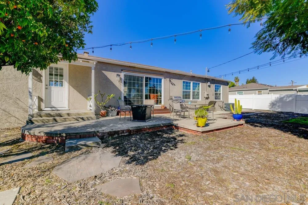 6244 Lorca Drive San Diego, CA 92115 - Photo 17 of 25 a view of backyard of house with outdoor seating