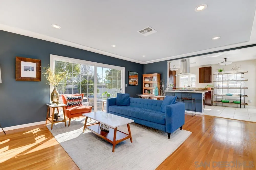 6244 Lorca Drive San Diego, CA 92115 - Photo 2 of 25 a living room with furniture and a flat screen tv