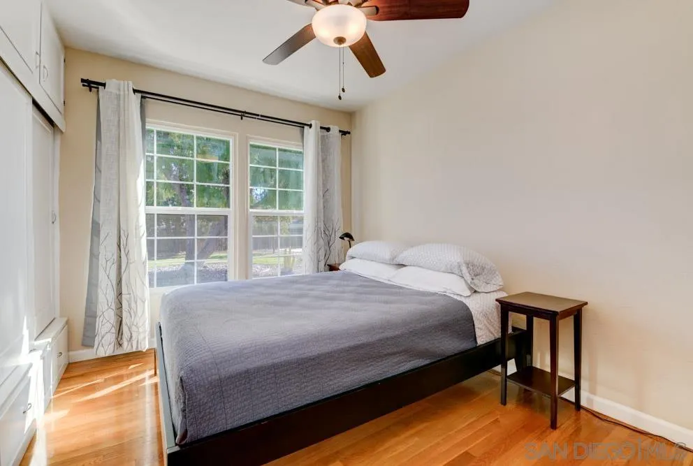 6244 Lorca Drive San Diego, CA 92115 - Photo 21 of 25 a bedroom with a bed and a window
