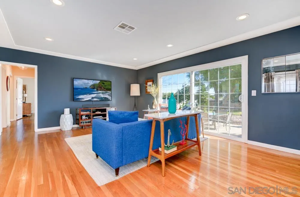 6244 Lorca Drive San Diego, CA 92115 - Photo 3 of 25 a living room with furniture and a flat screen tv