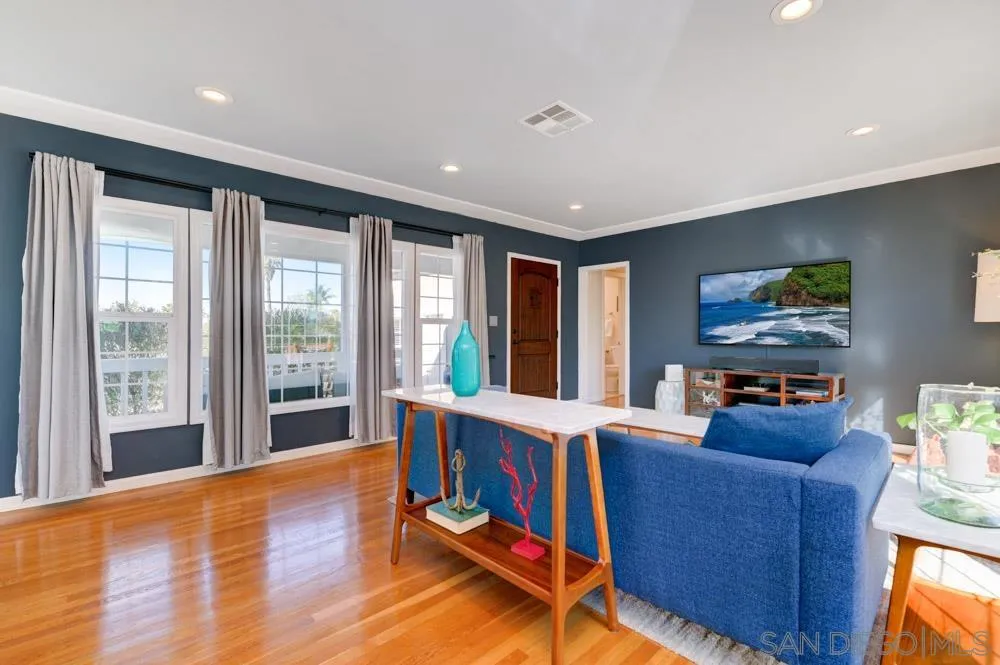 6244 Lorca Drive San Diego, CA 92115 - Photo 4 of 25 a living room with furniture and a flat screen tv